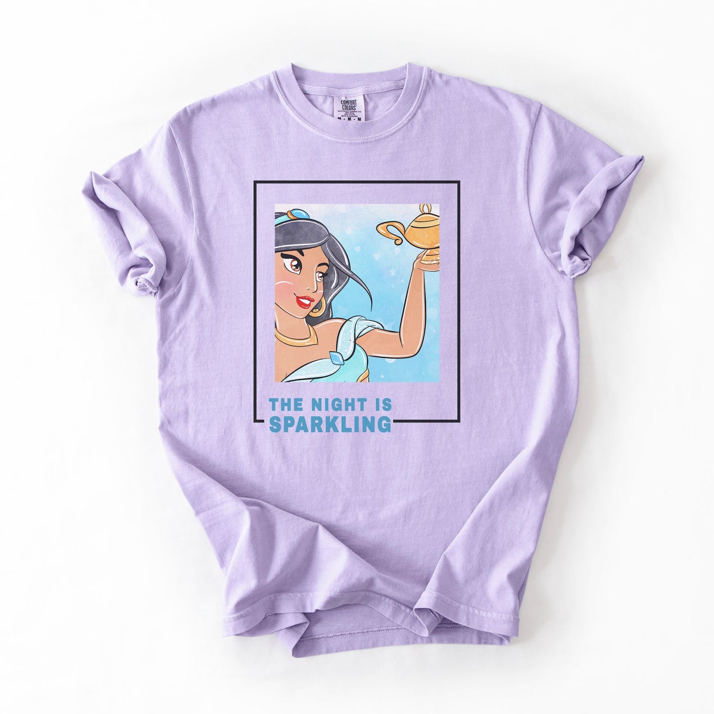 Lavender t-shirt with a graphic of a character holding a lamp and text 'The Night is Sparkling' on a white background.